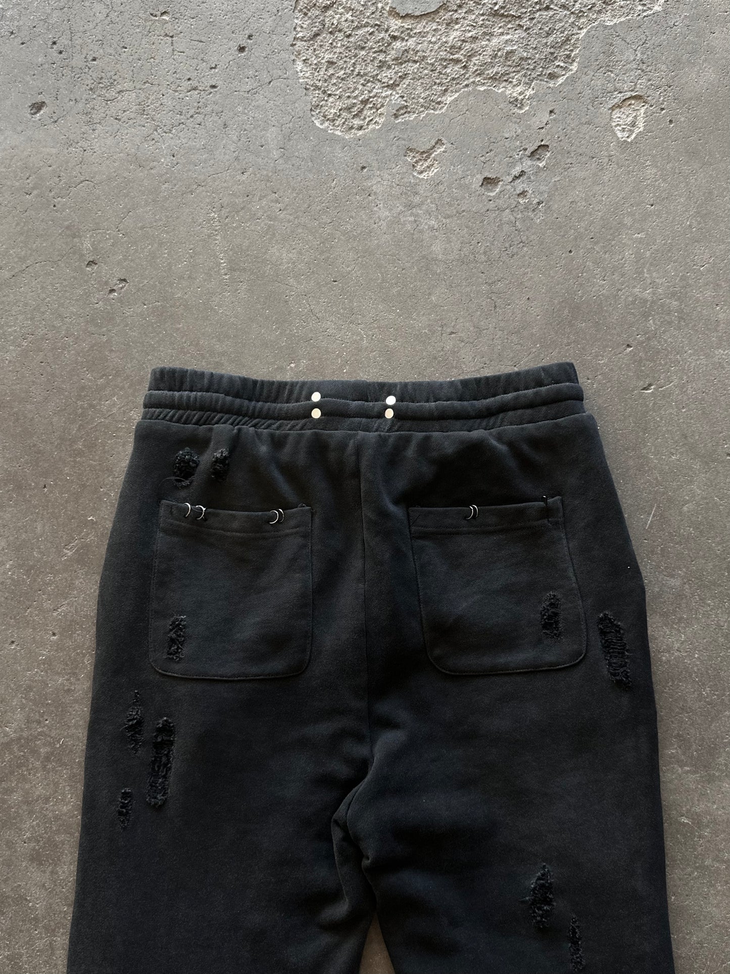PIERCED DISTRESSED SWEATPANTS