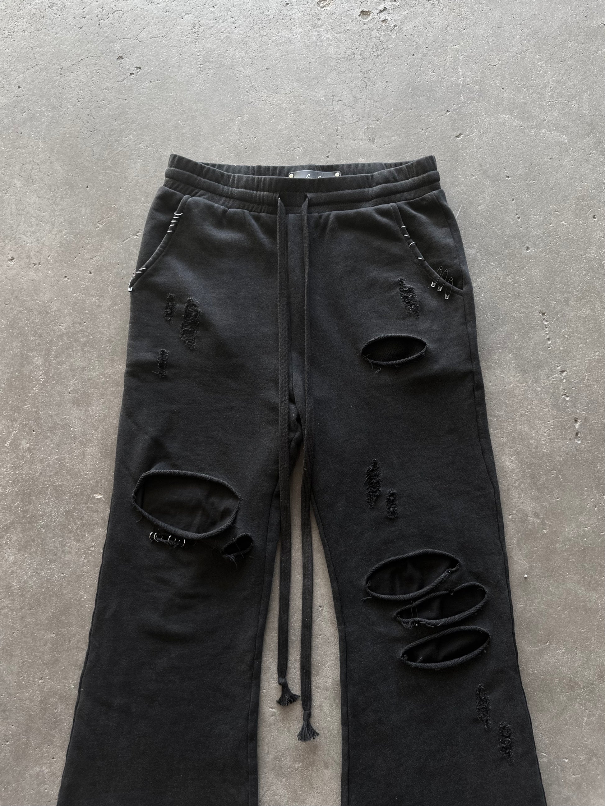 PIERCED DISTRESSED SWEATPANTS